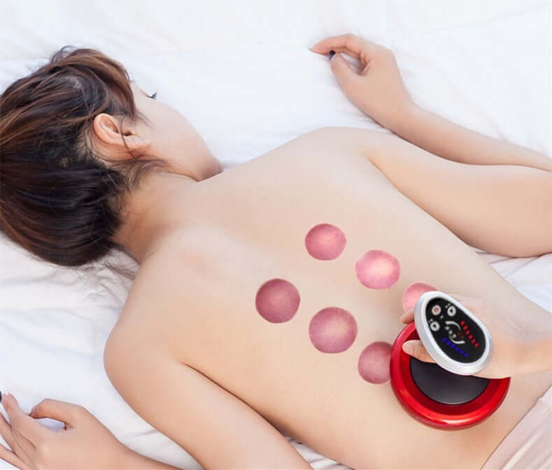 Woman receiving treatment with an electric negative pressure suction device on her back for relaxation and physiotherapy.