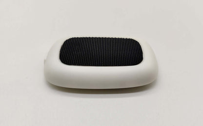 Smart posture corrector device with a sleek design and textured surface for improved back support.