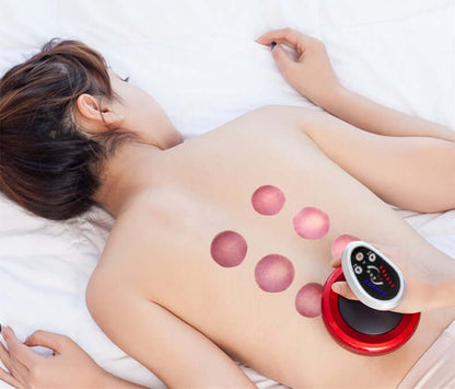 Woman receiving treatment with an electric negative pressure suction device on her back for relaxation and physiotherapy.